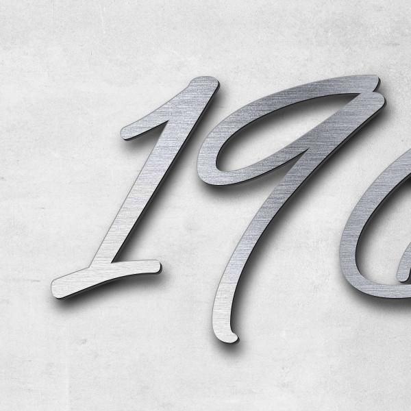 Schriftzug "1961-2024" in Schriftart "Jessari", Acryl-Kunststoff in Edelstahl-Optik gebürstet - hoch