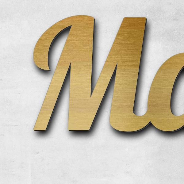 Schriftzug "Margarethe Zegke" in Schriftart "Catdog", Acryl-Kunststoff in Messing-Optik gebürstet -