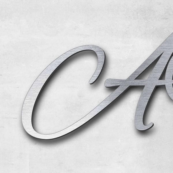 Schriftzug "AV" in Schriftart "Jessari", Acryl-Kunststoff in Edelstahl-Optik gebürstet - hochwertig