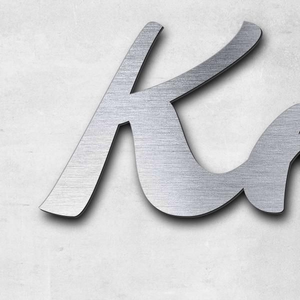 Schriftzug "Knolli" in Schriftart "Molarite", Acryl-Kunststoff in Edelstahl-Optik gebürstet - hochwe