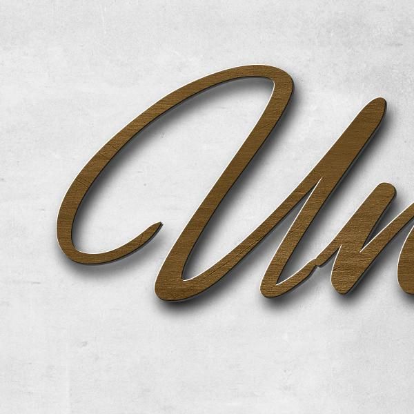 Schriftzug "Unvergessen" in Schriftart "Jessari", Messing antik patiniert - hochwertig & wetterbestä