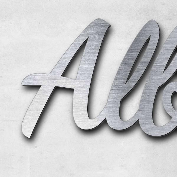 Schriftzug "Albrecht teerofen" in Schriftart "Filigrano", Acryl-Kunststoff in Edelstahl-Optik gebürs