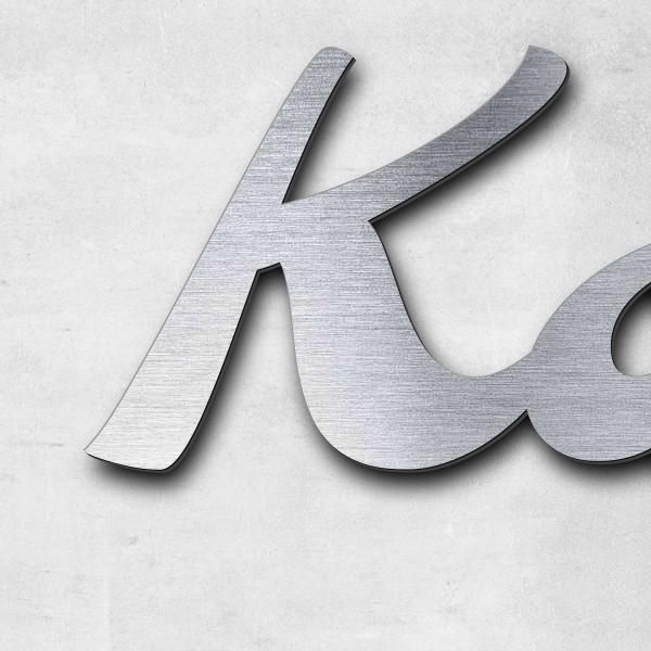 Schriftzug "Karlchen" in Schriftart "Molarite", Acryl-Kunststoff in Edelstahl-Optik gebürstet - hoch