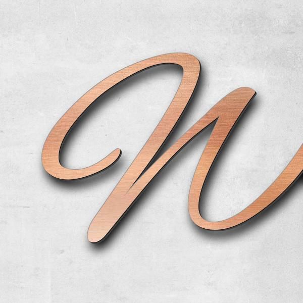 Schriftzug "Wir sind eins ..." in Schriftart "Jessari", Acryl-Kunststoff in Kupfer-Optik gebürstet -