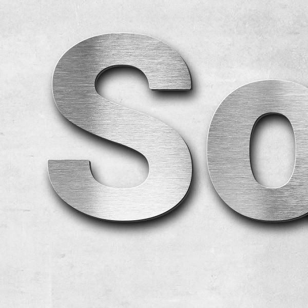 Schriftzug "Sozial-Kulturelles Zentrum (SKO) im ÖGZ" in Schriftart "Sans", Edelstahl V2A gebürstet -