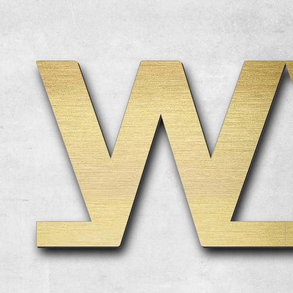 Schriftzug "ww.dzb-berlin.de" in Schriftart "Baseline", Acryl-Kunststoff in Messing-Optik gebürstet