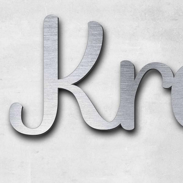 Schriftzug "Krage" in Schriftart "Autumna", Acryl-Kunststoff in Edelstahl-Optik gebürstet - hochwert