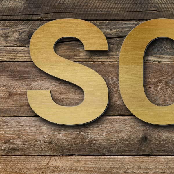 Schriftzug "SOUVENIRS" in Schriftart "Sans", Acryl-Kunststoff in Messing-Optik gebürstet - hochwerti