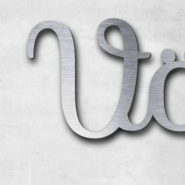 Schriftzug "Vögelnest" in Schriftart "Autumna", Acryl-Kunststoff in Edelstahl-Optik gebürstet - hoch