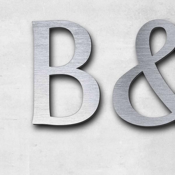 Schriftzug "B&W Martin" in Schriftart "Eternitas", Acryl-Kunststoff in Edelstahl-Optik gebürstet - h