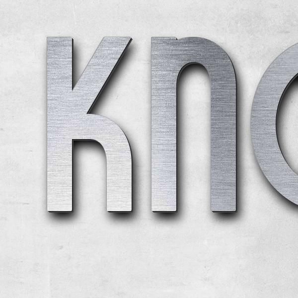 Schriftzug "Knobel" in Schriftart "Style 25", Acryl-Kunststoff in Edelstahl-Optik gebürstet - hochwe