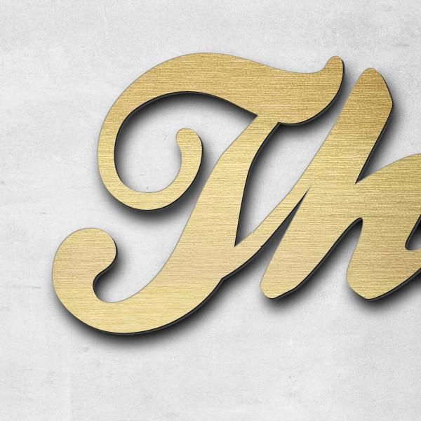 Schriftzug "The problem with the World" in Schriftart "Ballpark", Acryl-Kunststoff in Messing-Optik